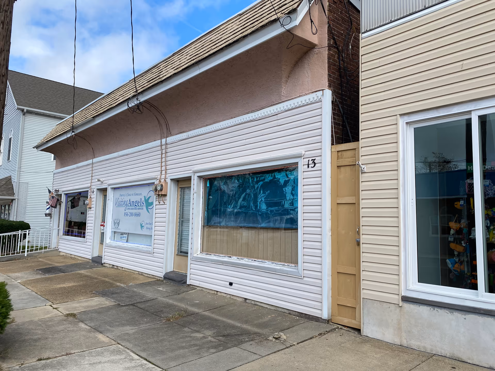 Front view of a Visiting Angels Senior Home Care storefront with windows.