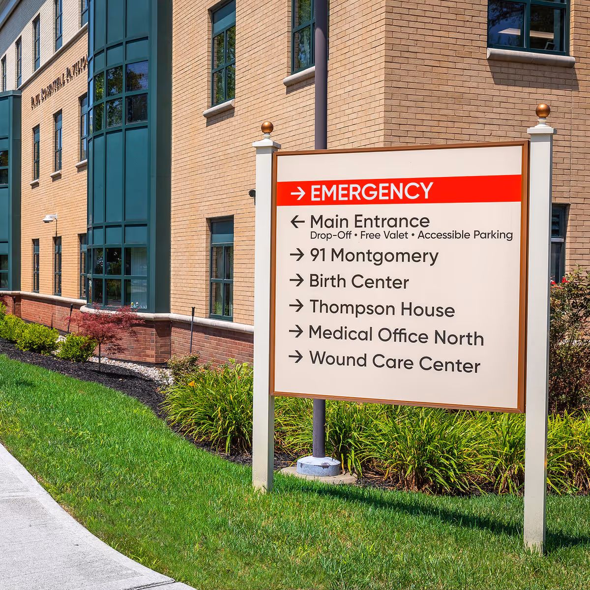 Exterior of Nuvance Health facility with emergency sign and directions.