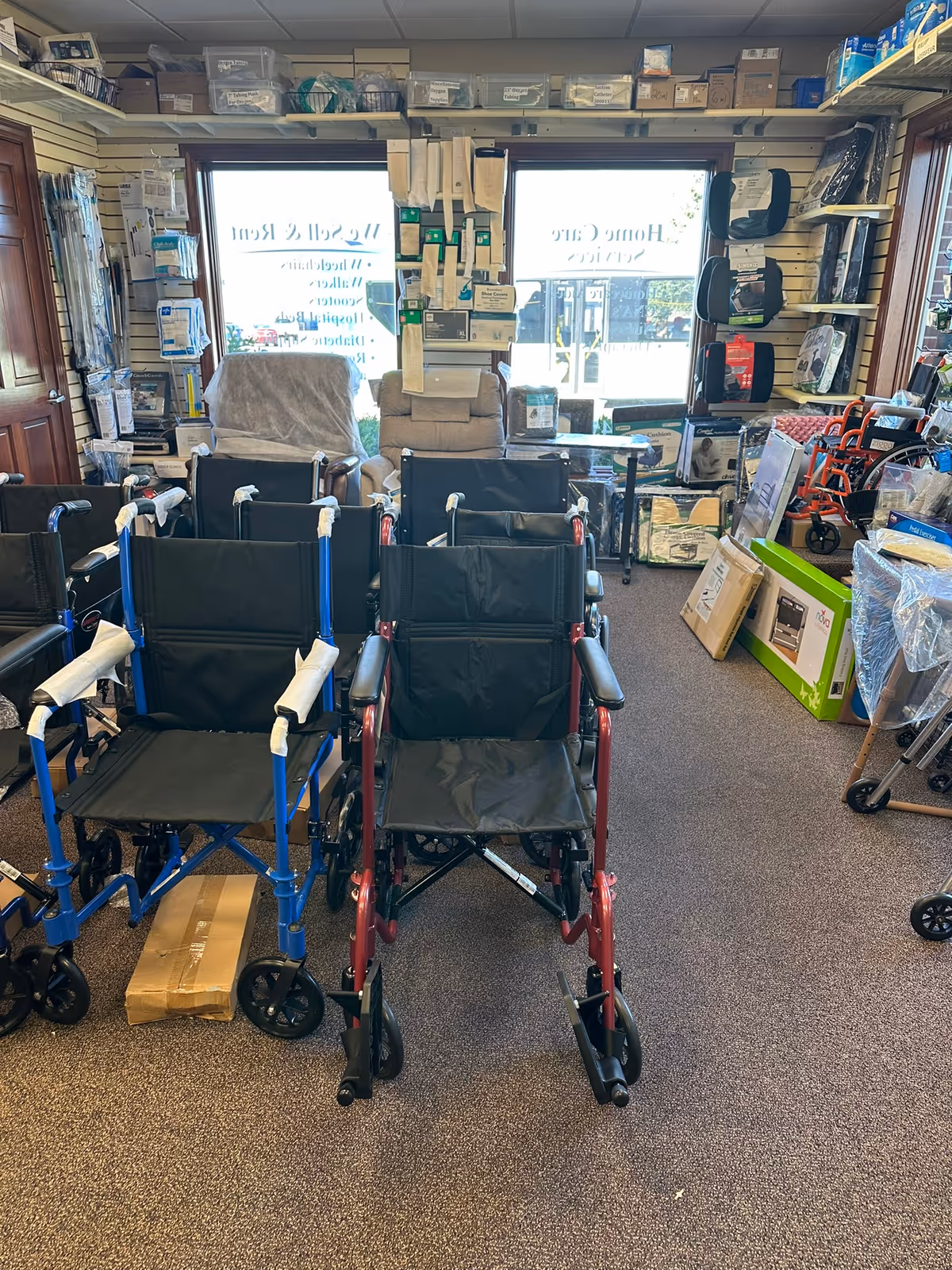 Interior showroom of Carepaks Health Services with wheelchairs and mobility aids.