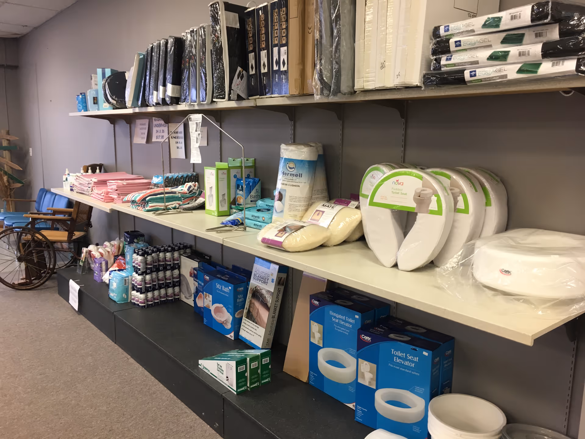 Shelves in a storage room stocked with medical supplies and equipment.