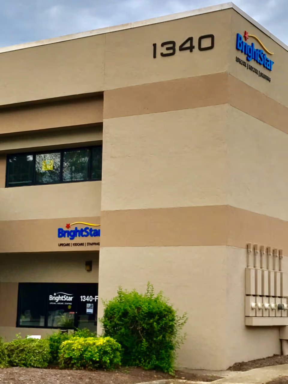 Exterior view of BrightStar Care building front at 1340 with landscaping.