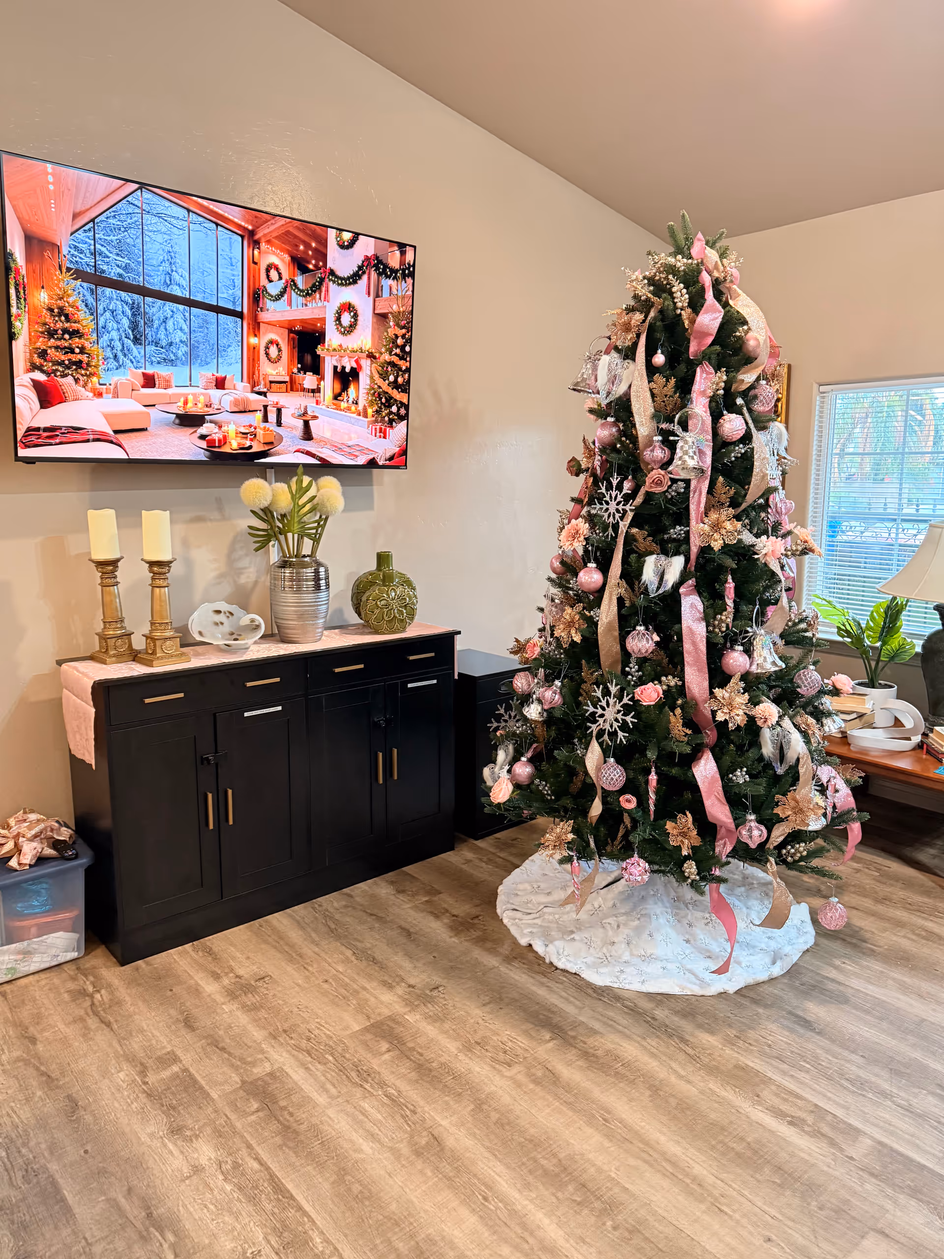 Cozy living room with Christmas tree, TV, and holiday decor.