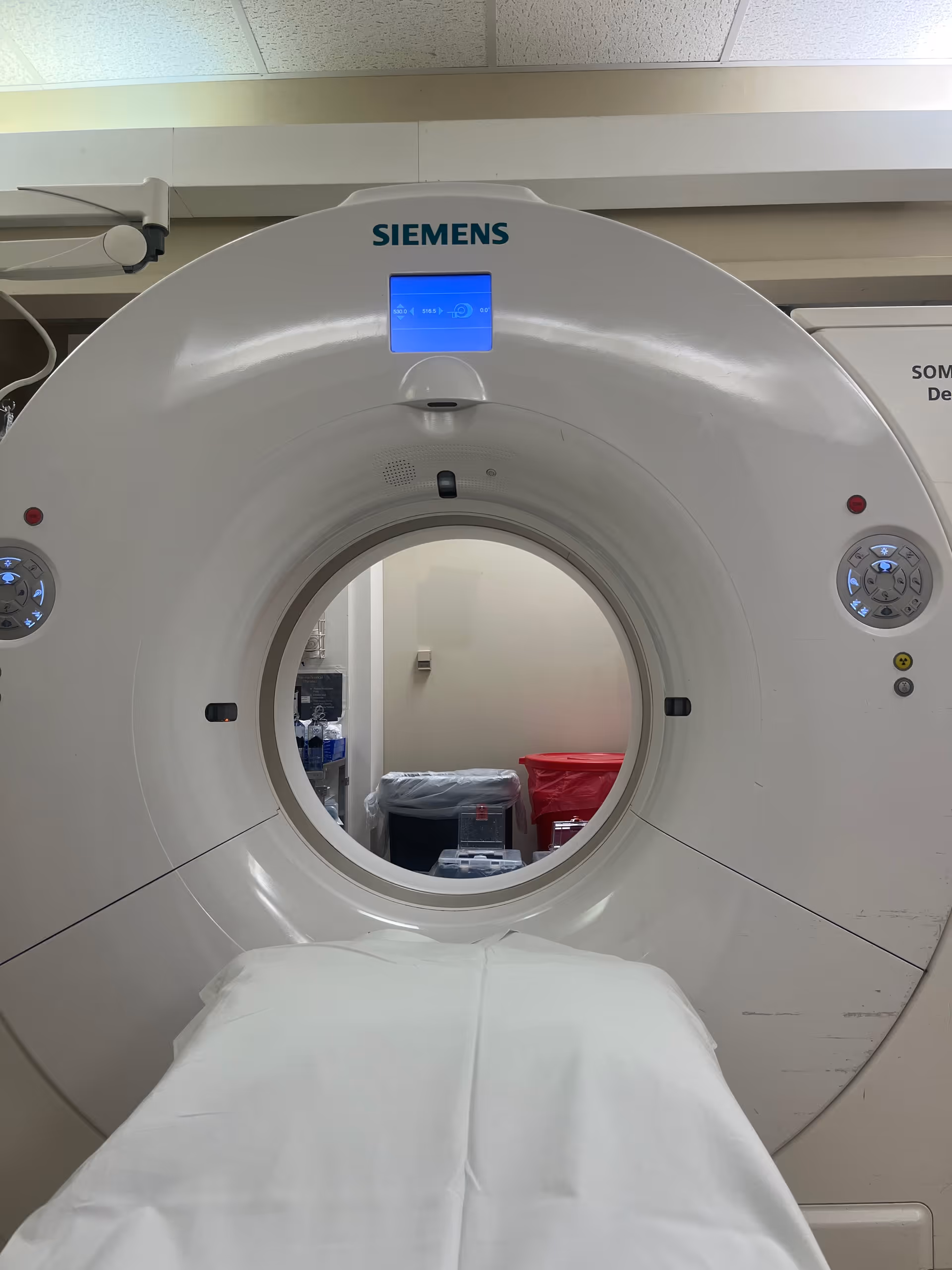 Siemens CT scanner in an interior medical imaging room.
