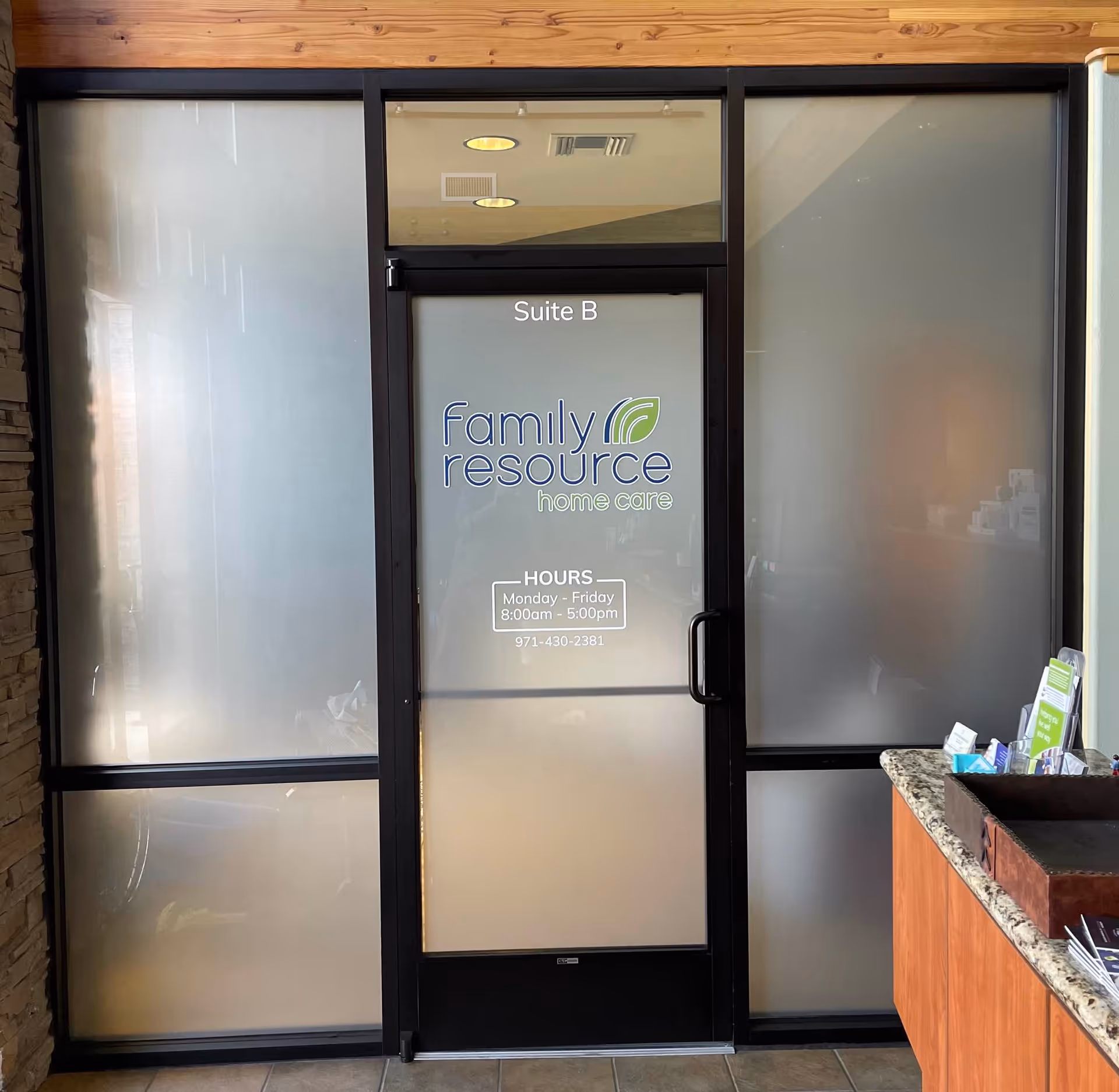 Frosted glass entrance door labeled Suite B for Family Resource Home Care.