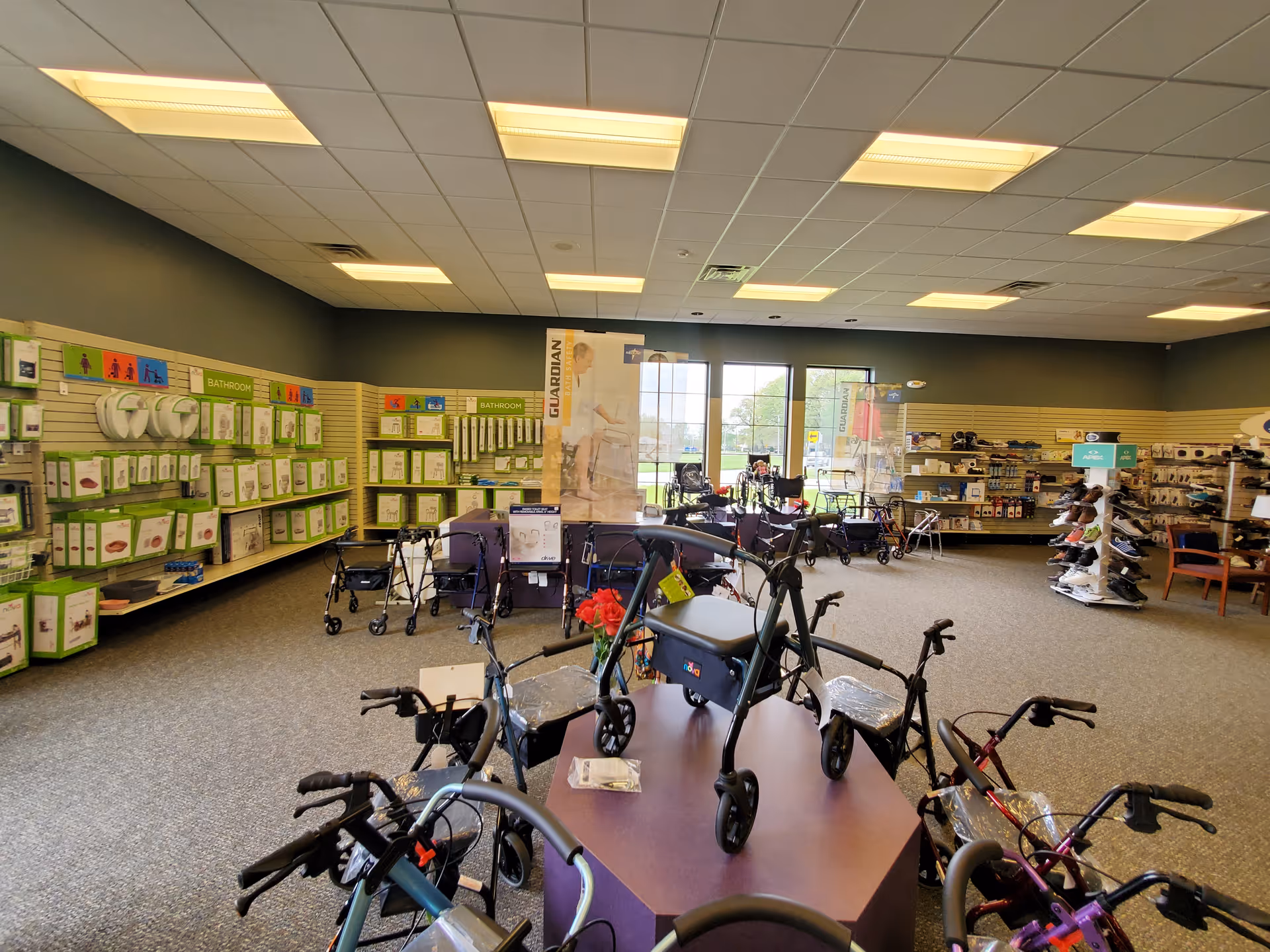 Interior showroom with walkers and mobility aids displayed along walls.