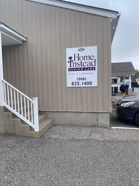 Exterior view of a Home Instead Senior Care building with a sign.