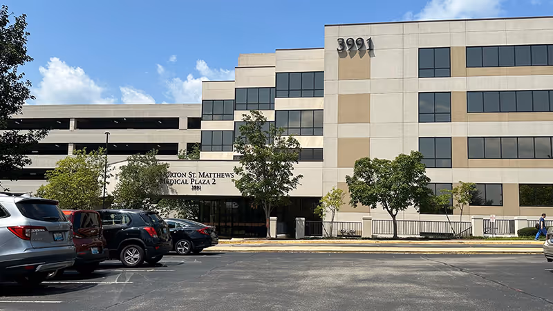 Exterior view of Norton St. Matthews Medical Plaza 2 building with a parking lot.