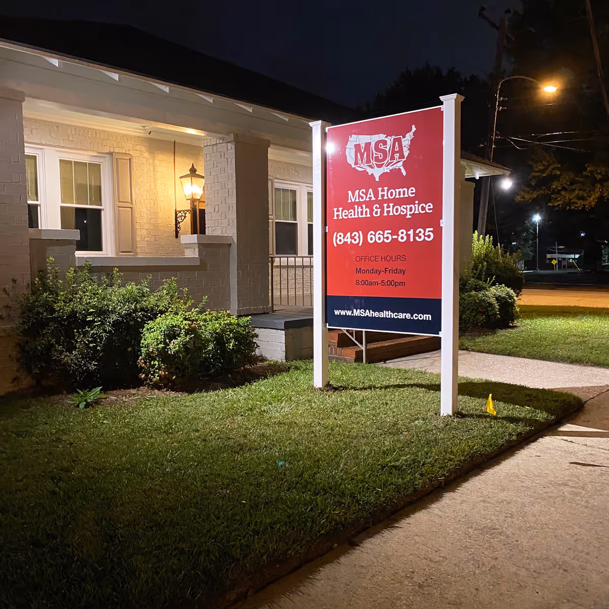 Night exterior of a building with a red MSA Home Health and Hospice sign.