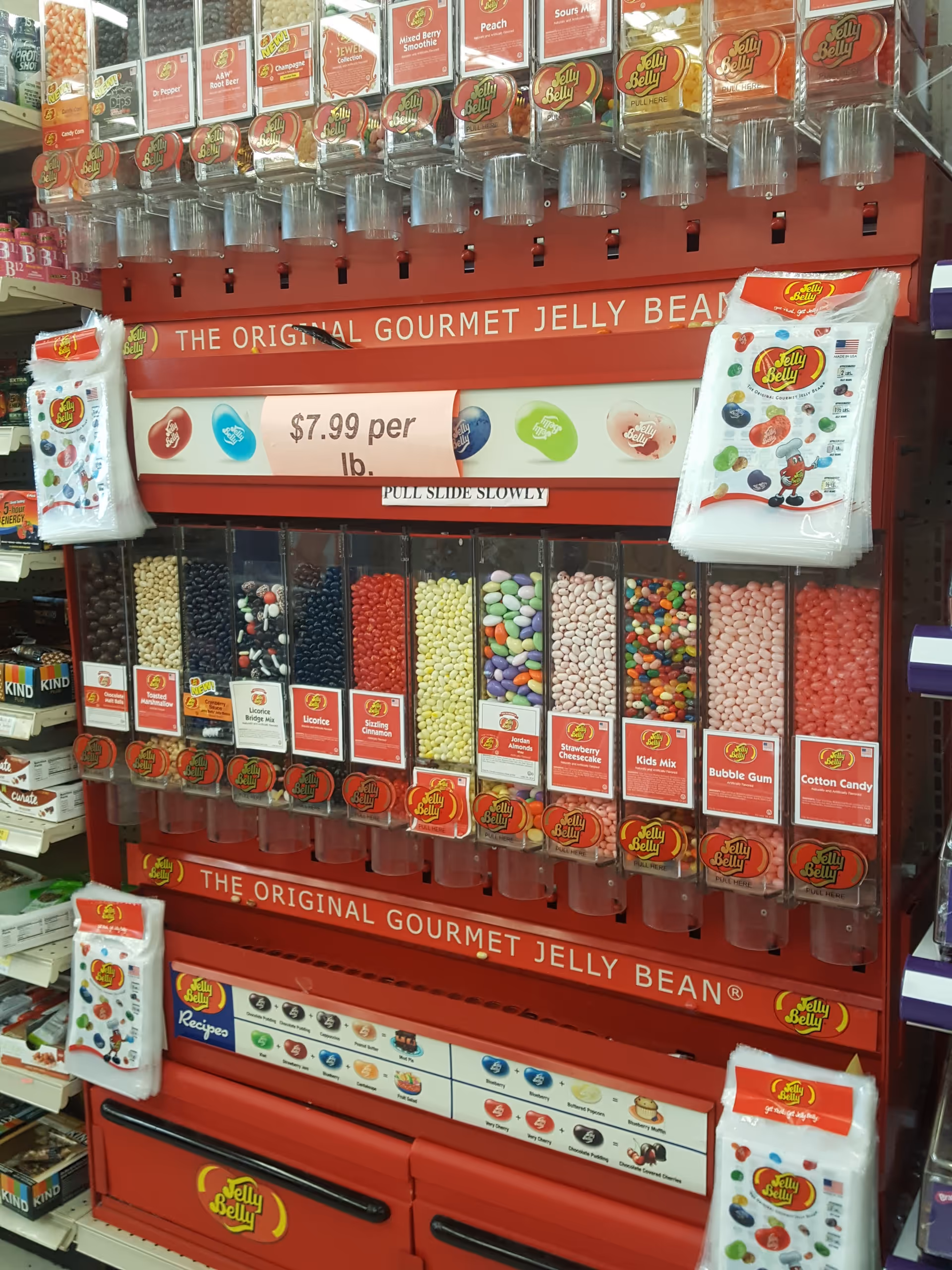Discount Drug Mart candy dispenser display with colorful jelly beans and clear tubes.