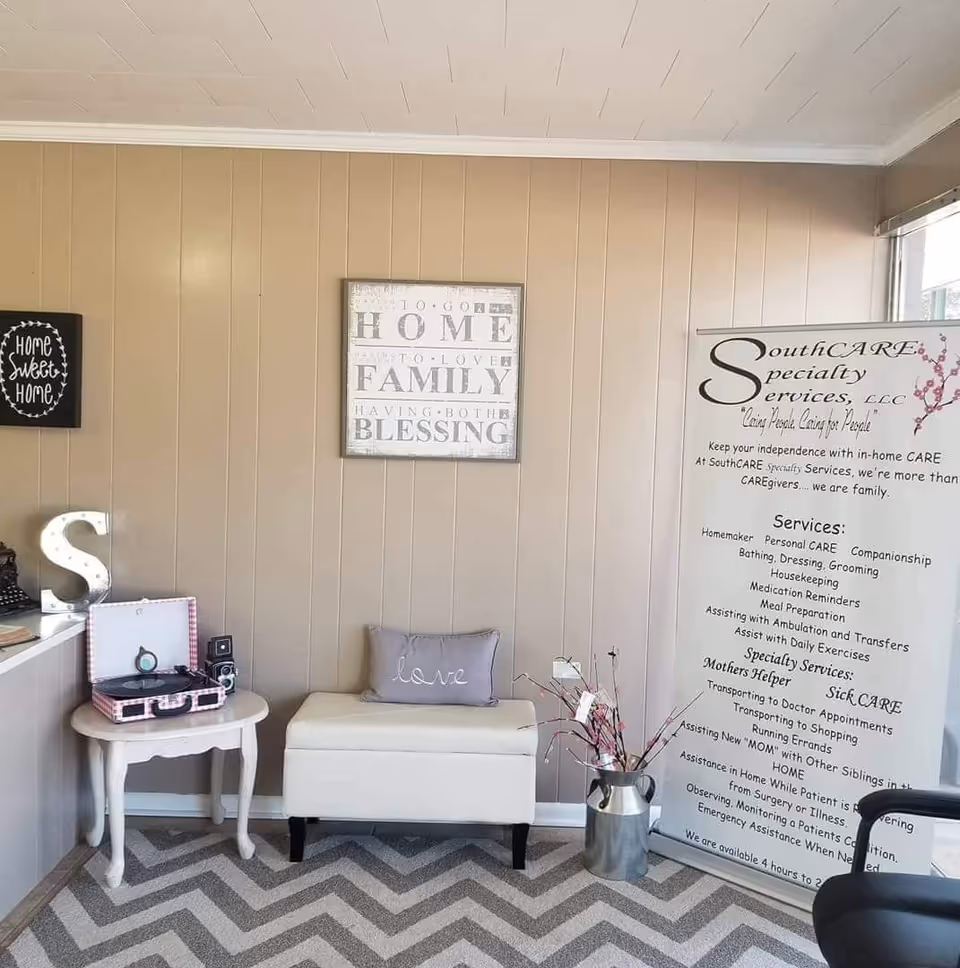 Indoor lobby area featuring signage, seating, and decor for SouthCARE.