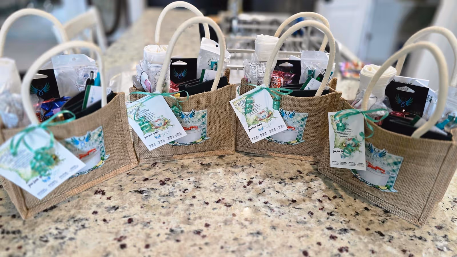 Row of burlap gift baskets with tags arranged on a speckled kitchen counter