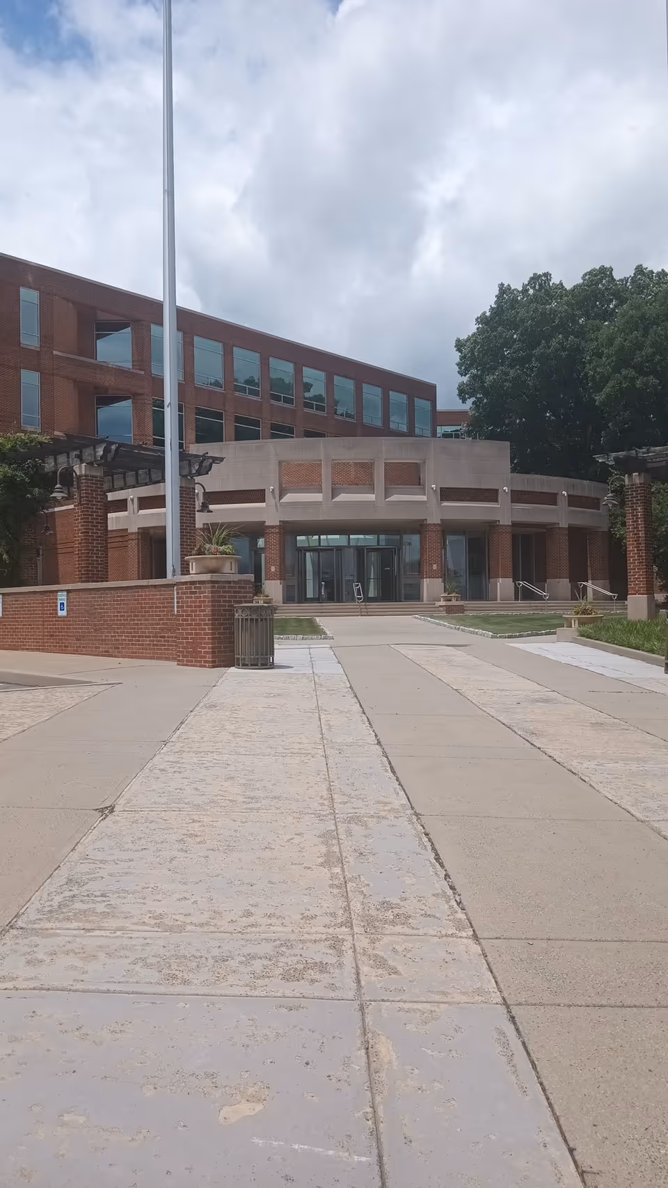 Front exterior view of Help at Home senior facility entrance with a walkway.