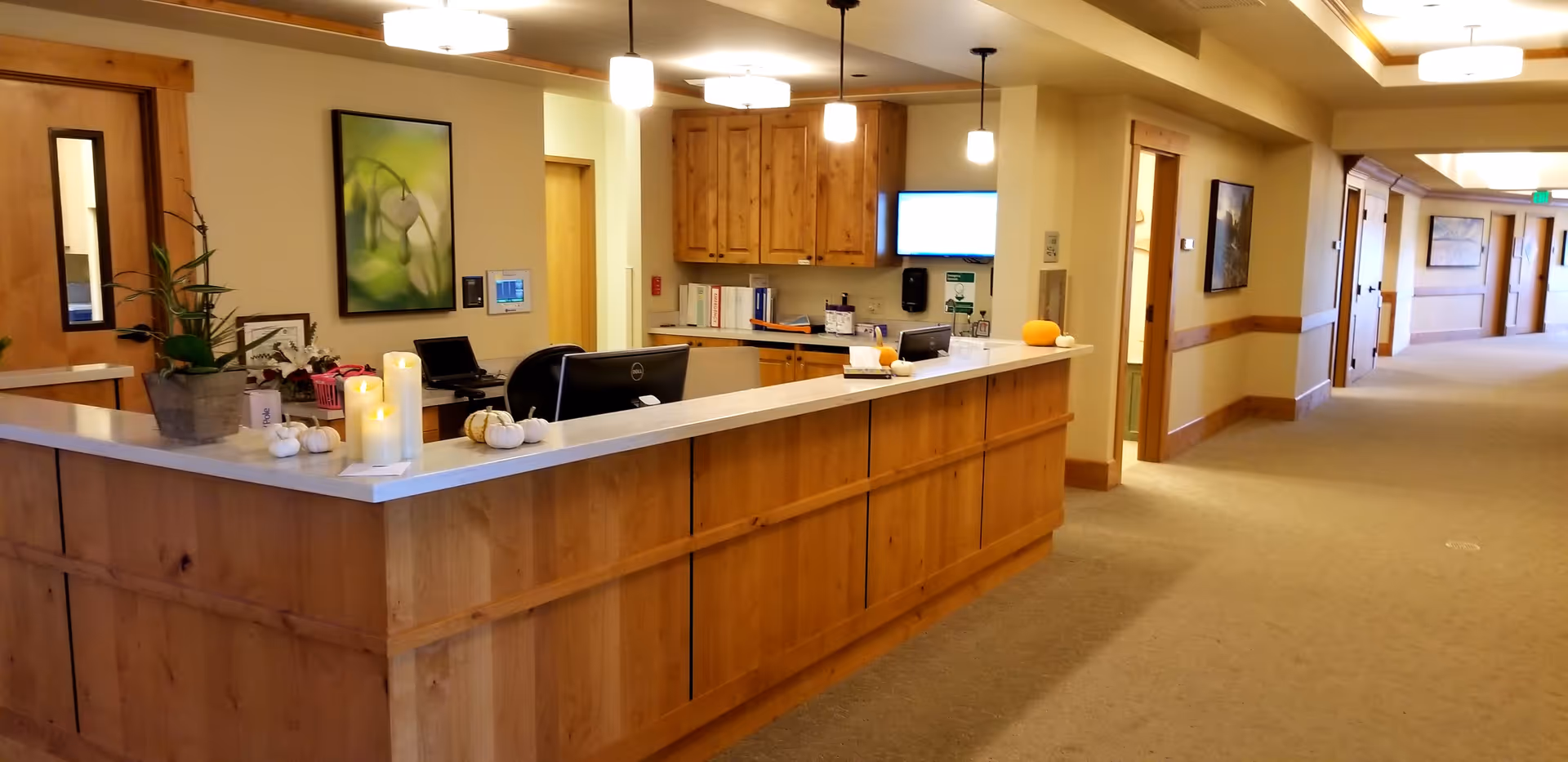 Reception desk along a hallway in the Pete Moore Hospice House interior.