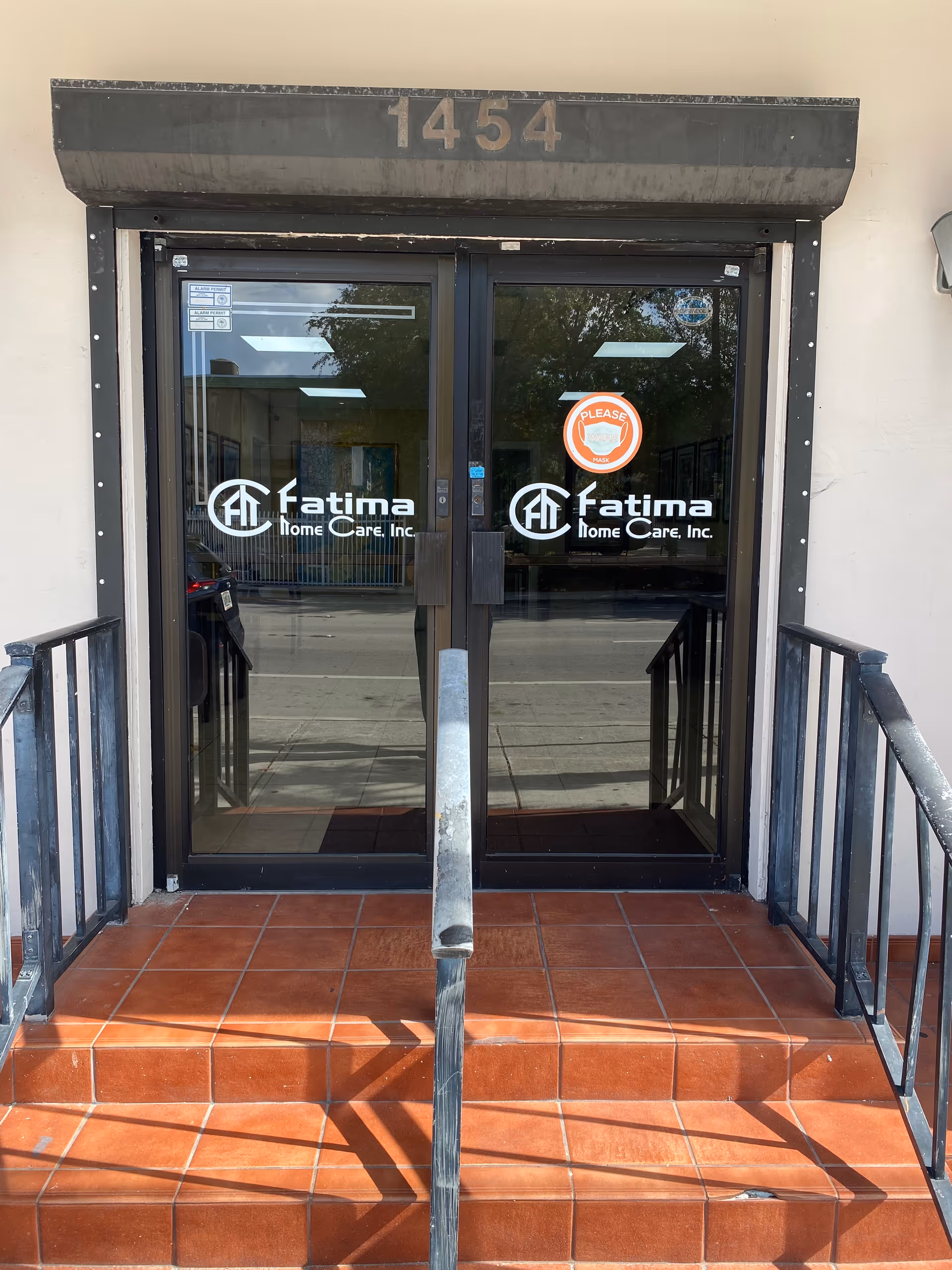 Front entrance of Fatima Home Care, Inc., glass doors and a red-tiled porch.