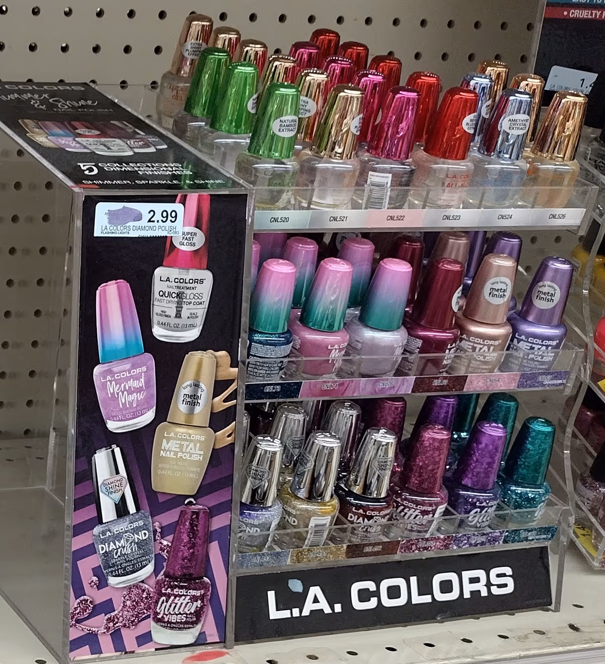 Colorful nail polish bottles on display shelves inside Discount Drug Mart