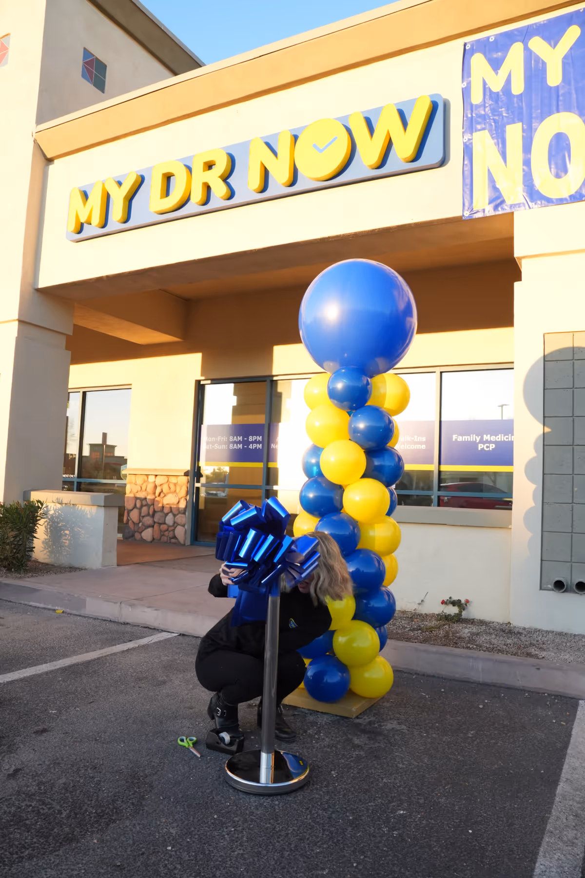 Exterior of MY DR NOW facility with balloon decorations at entrance