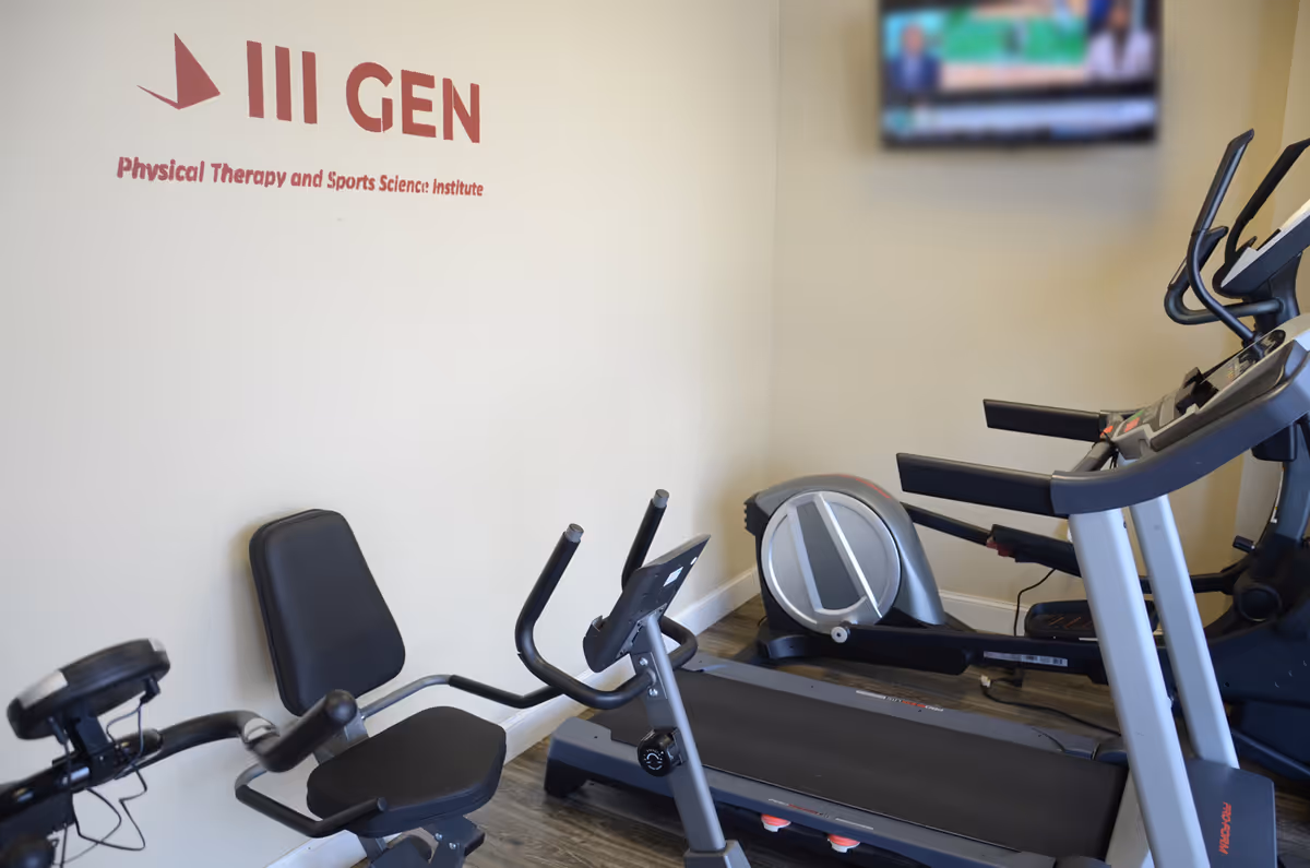 Interior gym with treadmills, bikes, and a wall logo reading III GEN