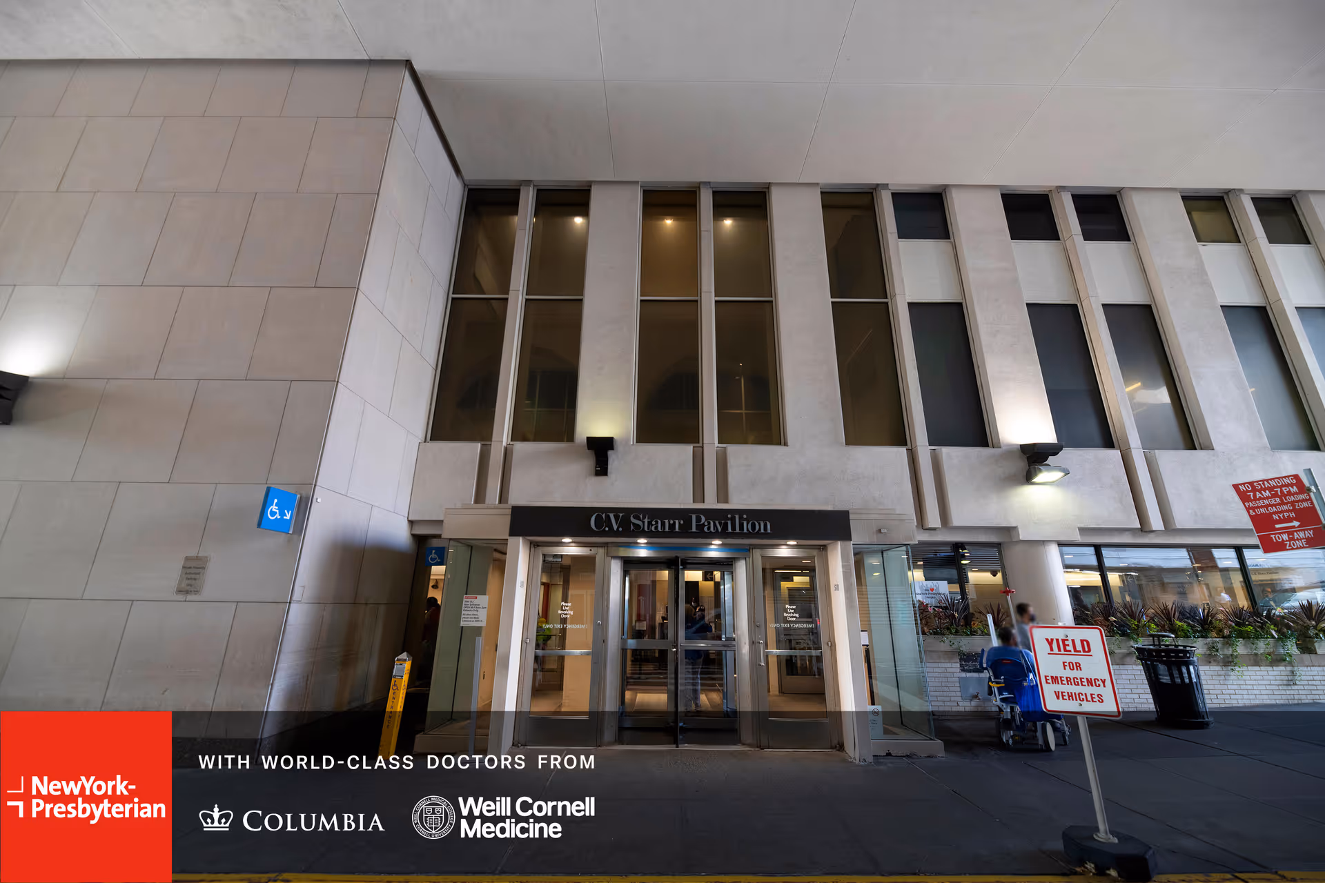 Exterior view of the CV Starr Pavilion entrance with glass doors at a hospital campus.