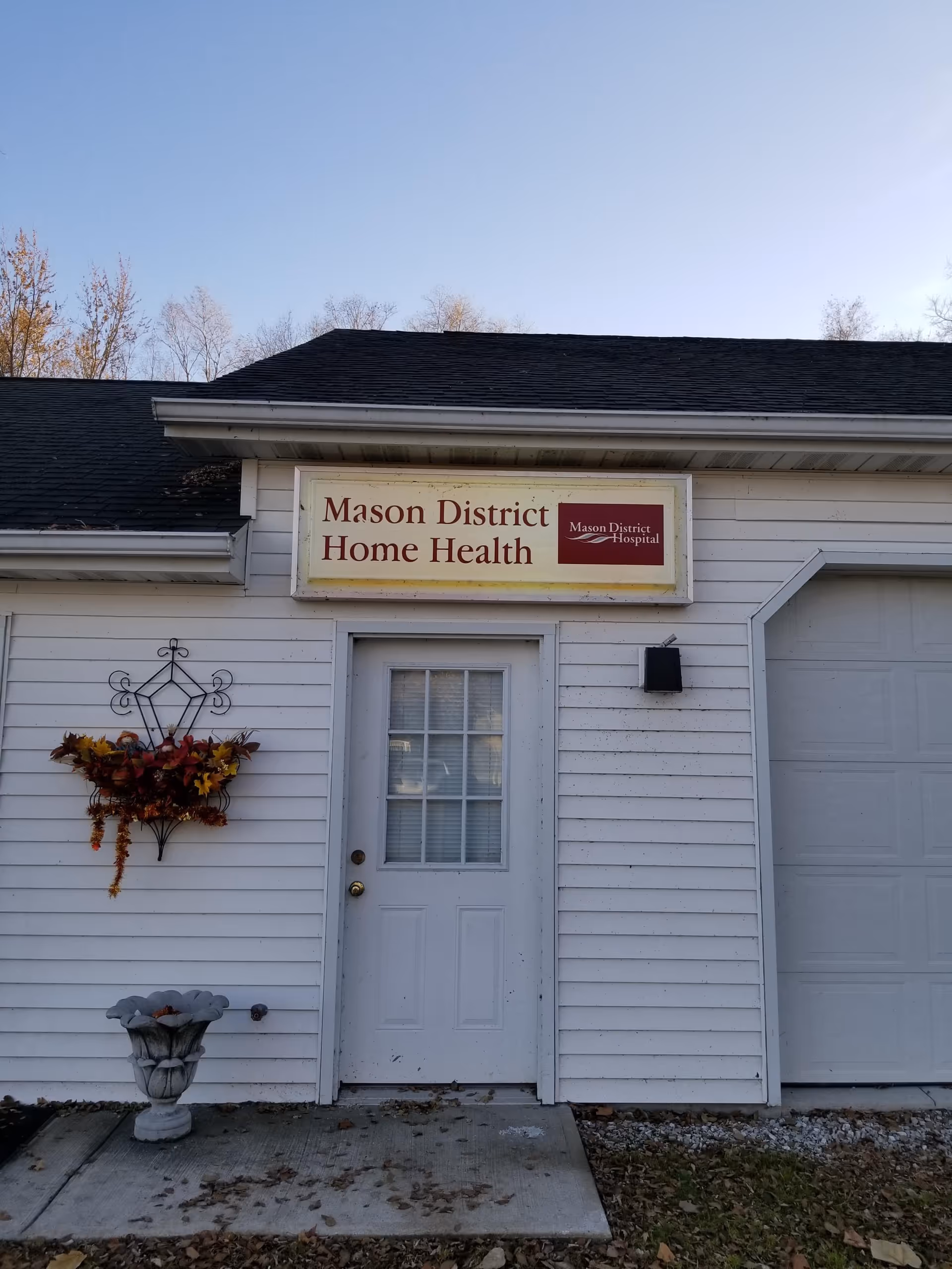 White building facade with Mason District Home Health sign above the front door.