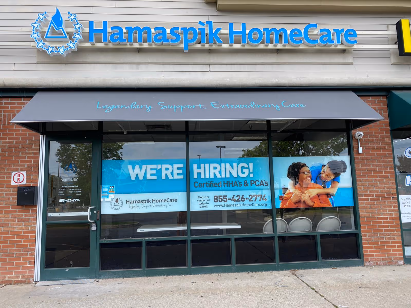 Exterior view of Hamaspik HomeCare storefront with a WE'RE HIRING banner in the window.