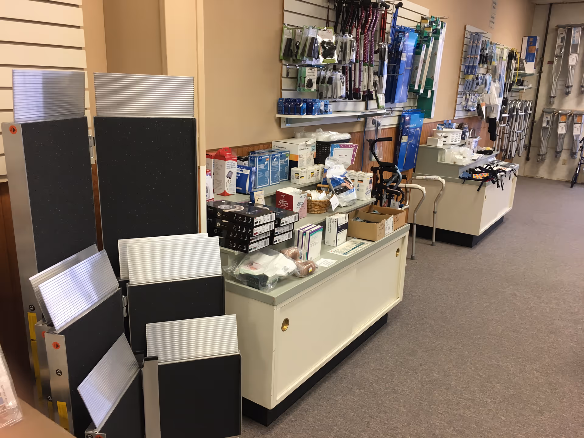 Interior store aisle displaying medical equipment and mobility aids on shelves.