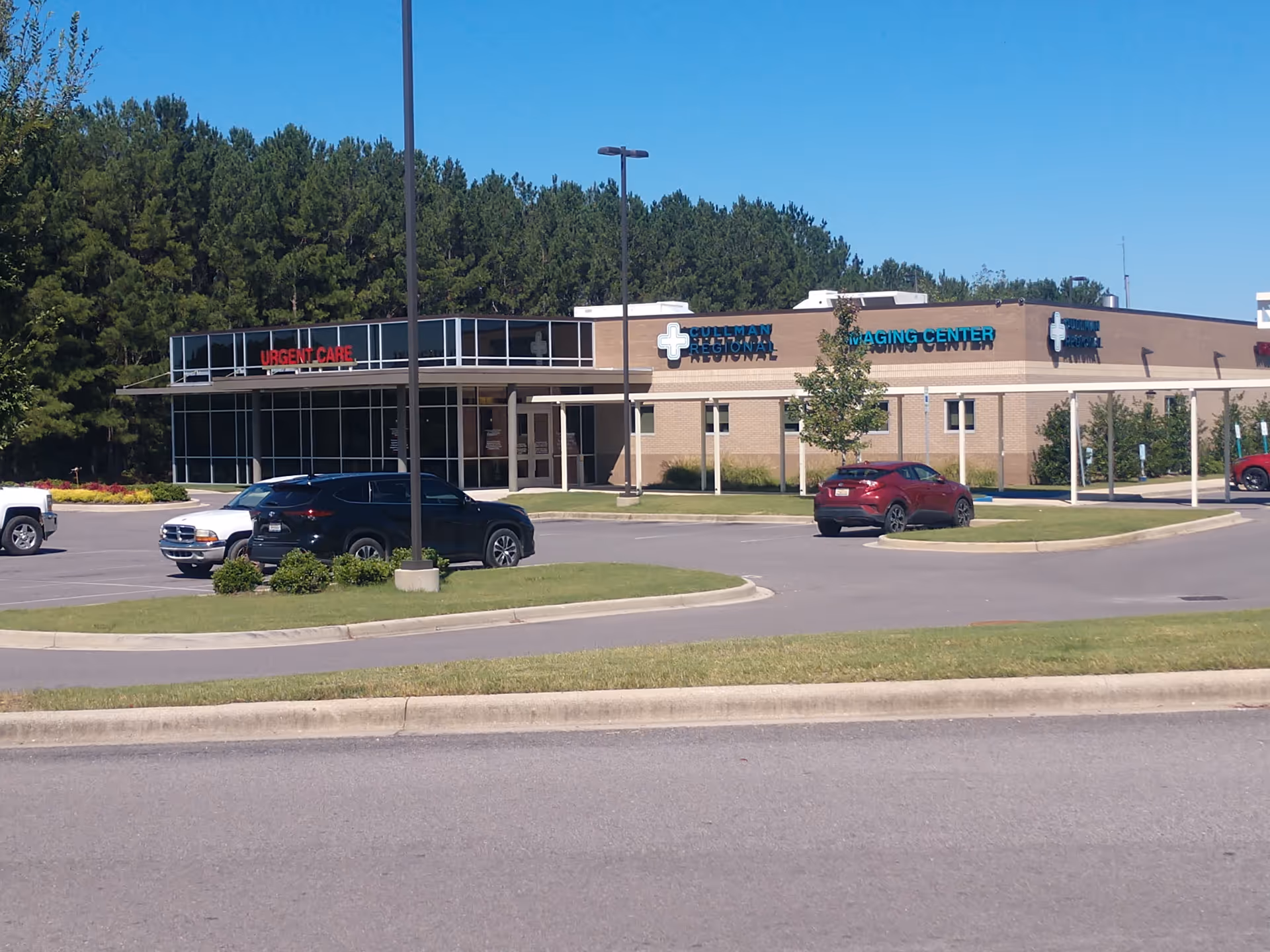 Exterior view of Cullman Regional Medical Center with a parking lot.