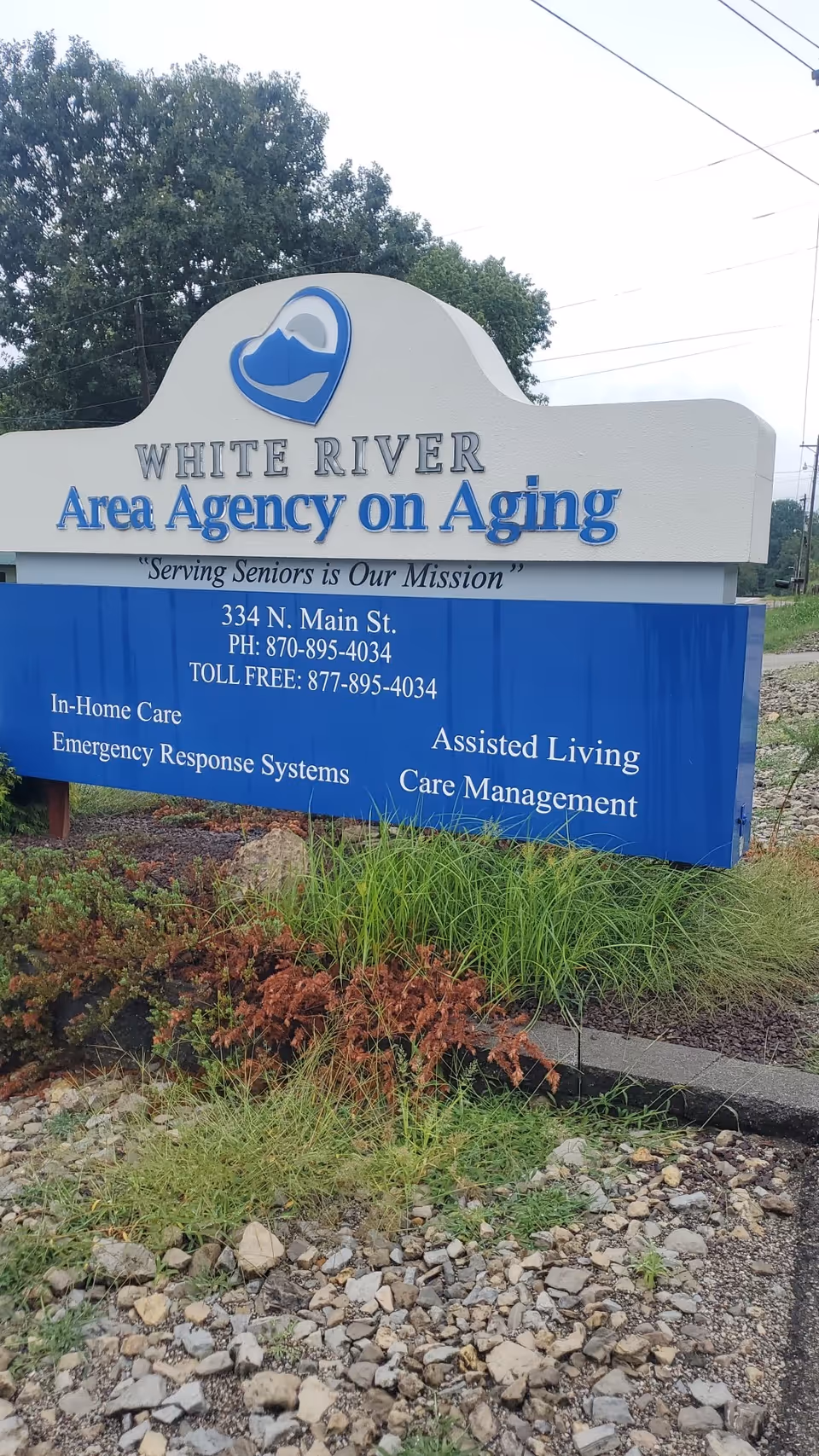 Outdoor sign for White River Area Agency on Aging with contact information