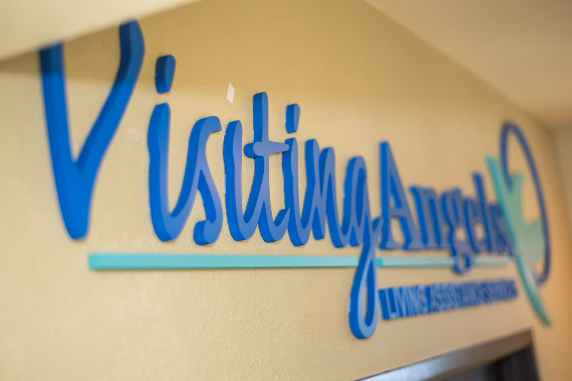 Interior wall sign for Visiting Angels Senior Home Care.