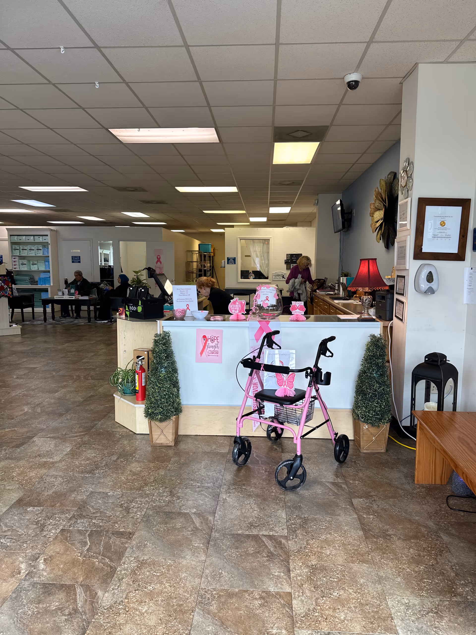 Commonwealth Home Health Care lobby with a pink walker at the front desk.