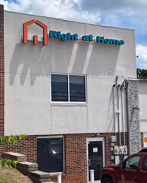 Exterior view of Right at Home senior living facility with signage.