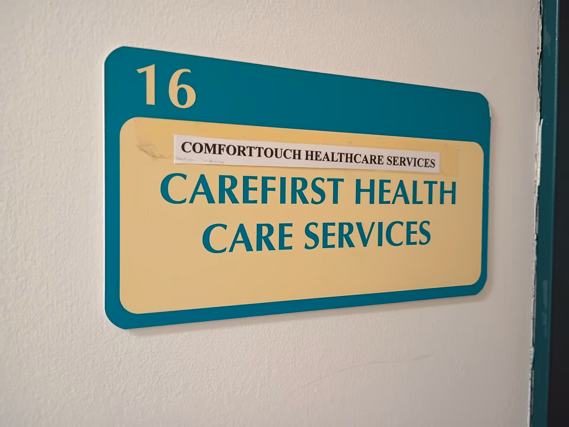 Interior wall sign reading Carefirst Health Care Services with the number 16.