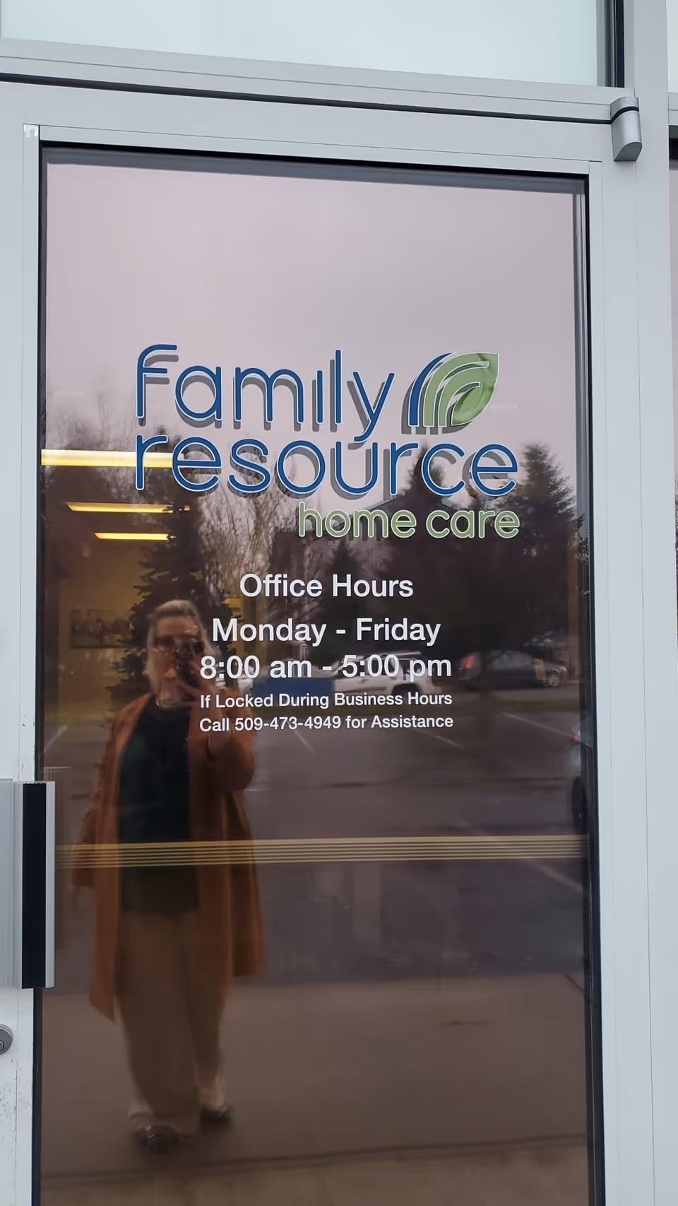 Front door shows Family Resource Home Care logo and office hours reflected in glass.