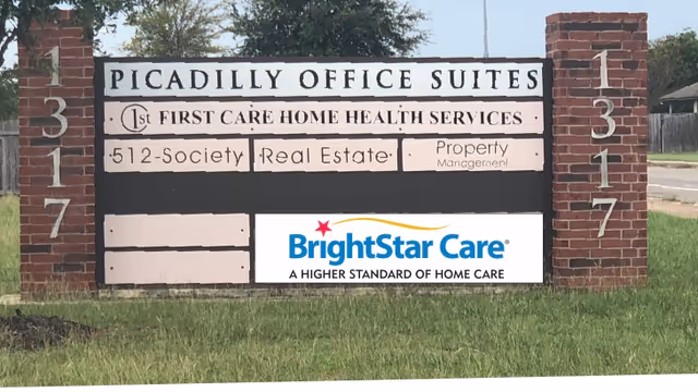 Exterior sign display for BrightStar Care at Picadilly Office Suites entrance with brick posts.