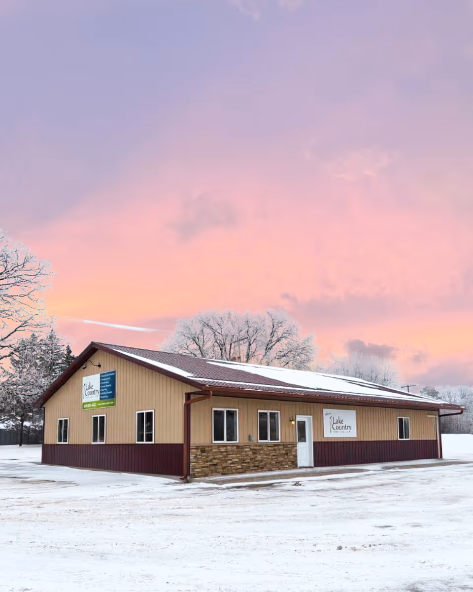 Exterior view of Lake Country Home Care, LLC building in a snowy landscape.