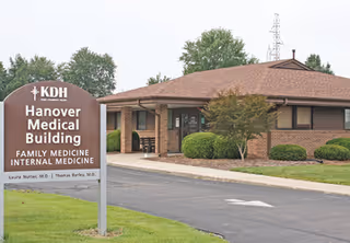 Front exterior view of Norton King's Daughters' Health Hanover Medical Building with sign in parking lot.
