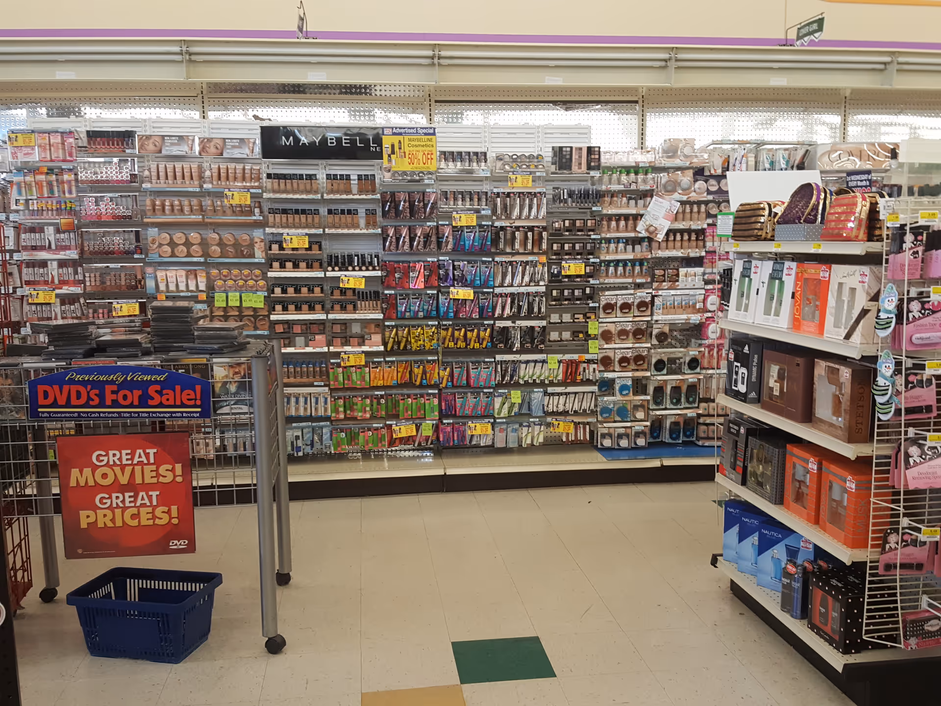 Aisle lined with cosmetics and beauty products in Discount Drug Mart.