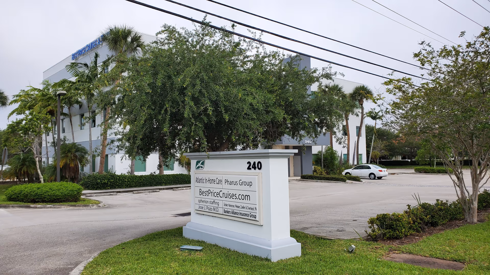 Exterior view of Atlantic In-Home Care facility with a sign and a parking lot.