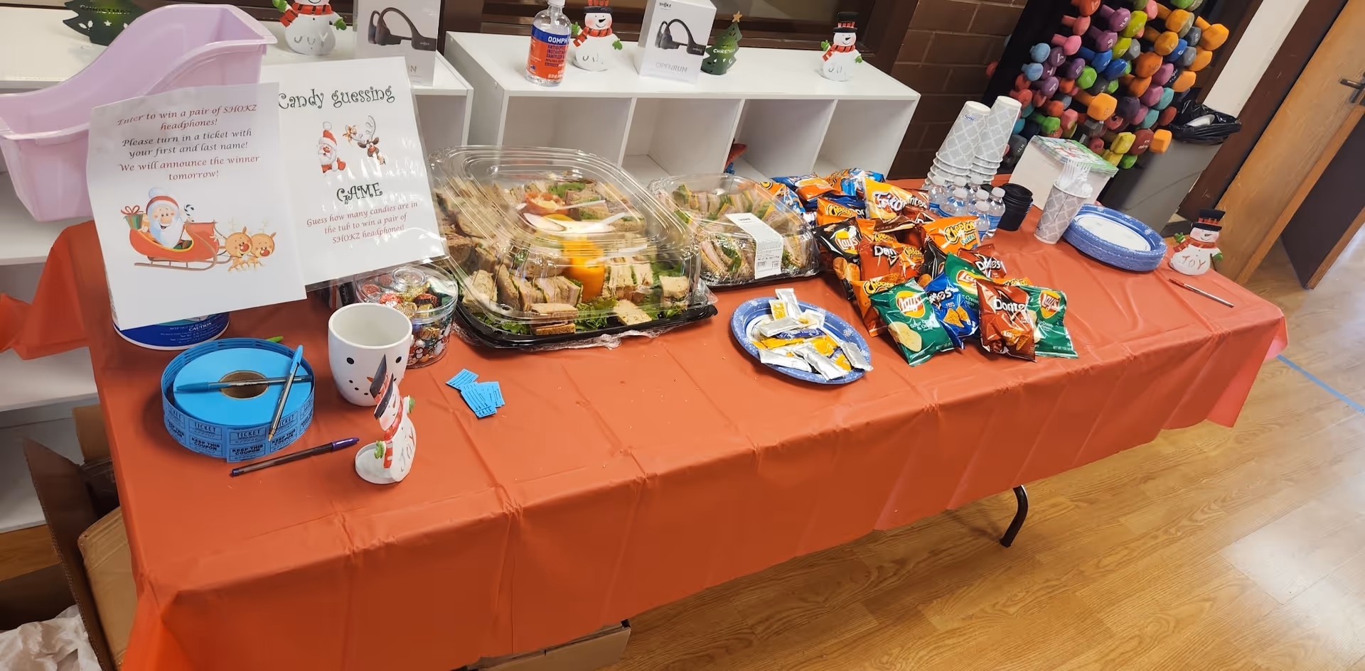 Snack table with chips, pastries, and candy at a Senior Helpers facility.