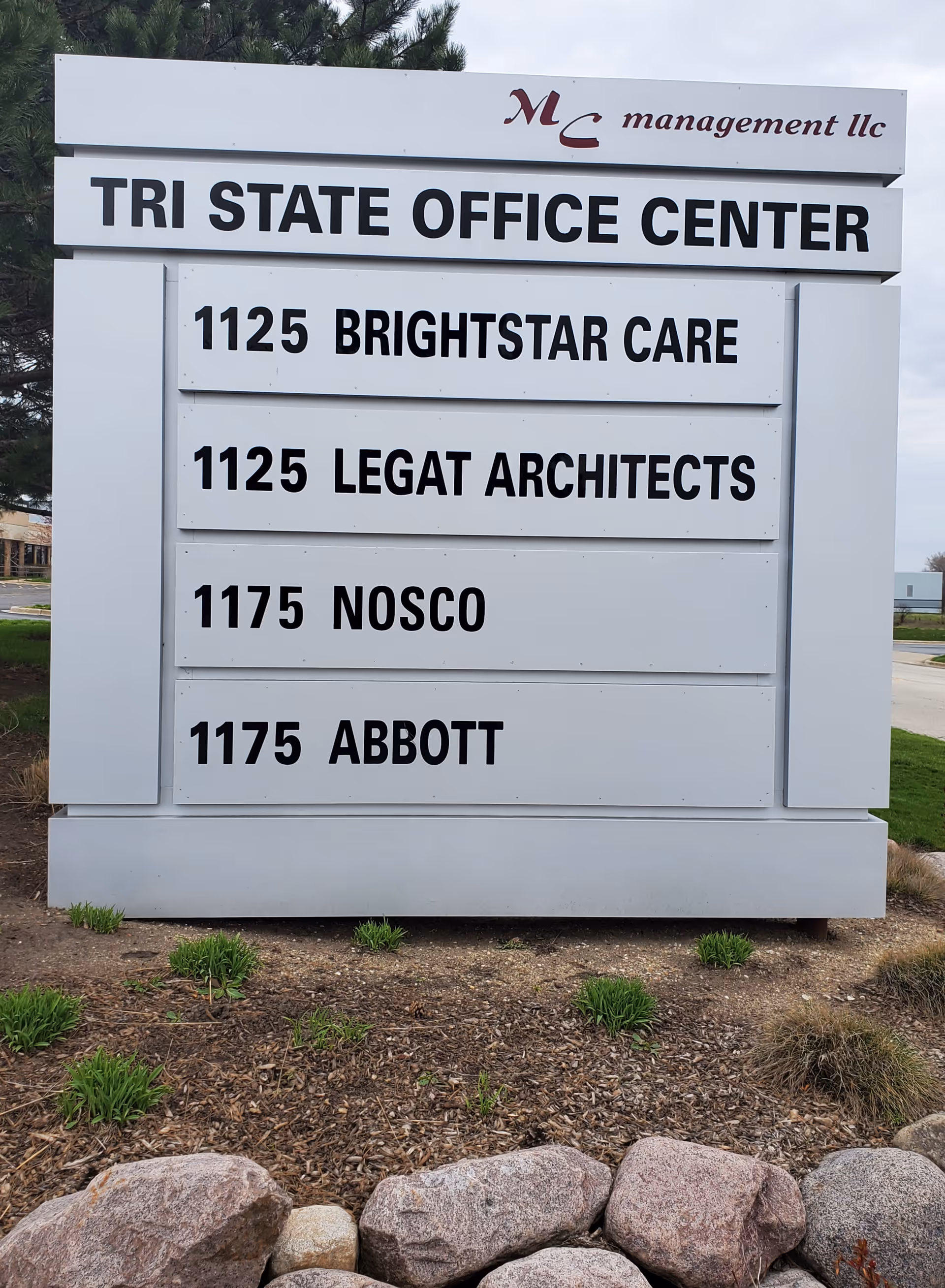 Outdoor sign for Tri State Office Center listing BrightStar Care among other tenants.
