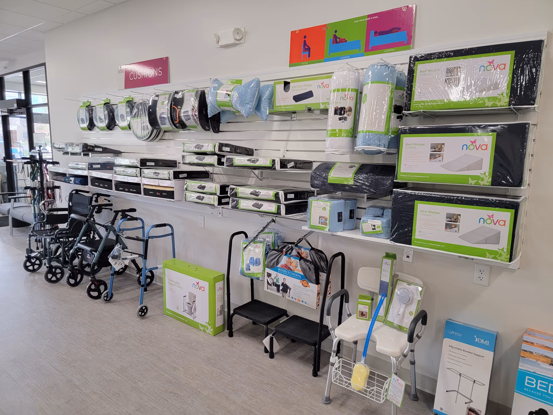 Showroom with walkers, wheelchairs, and bedding accessories displayed on wall shelves.