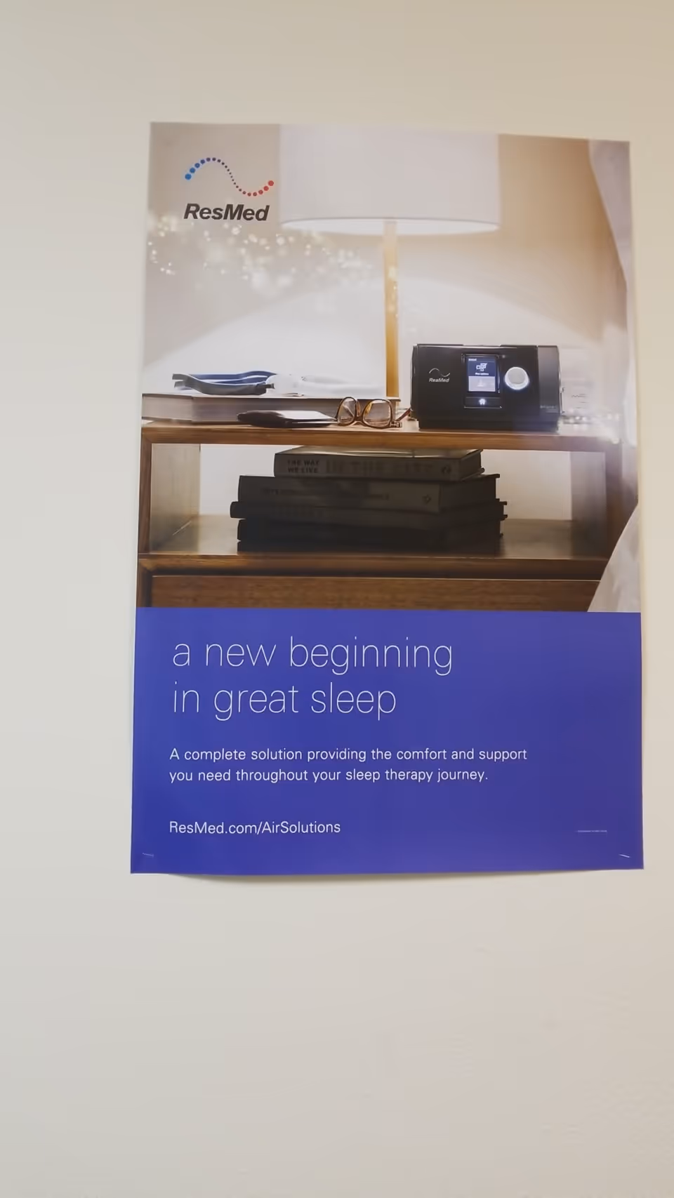 Poster advertising ResMed sleep therapy on an interior wall.