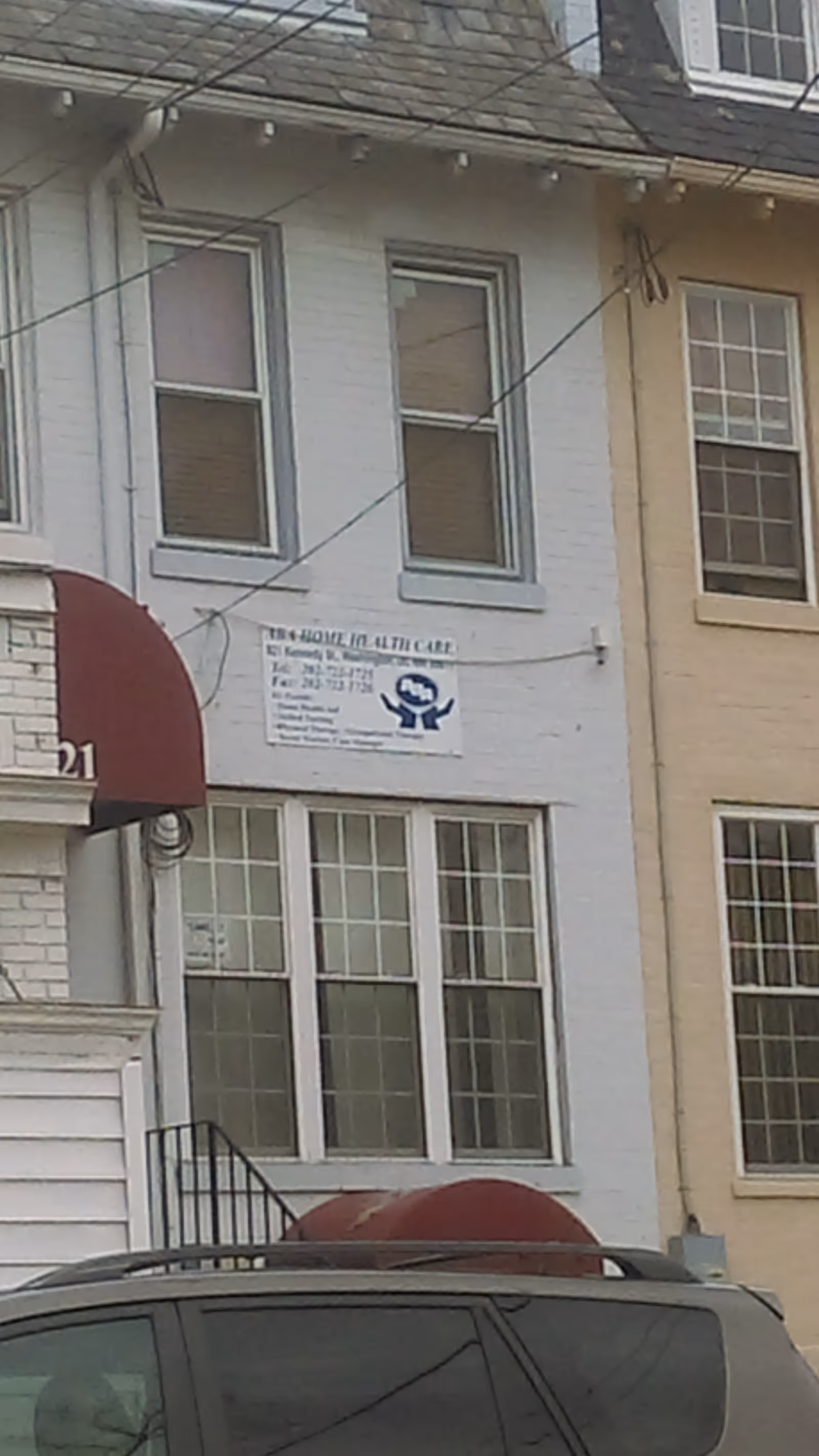 Front facade of a light-colored building with an ABA Home Health Care sign