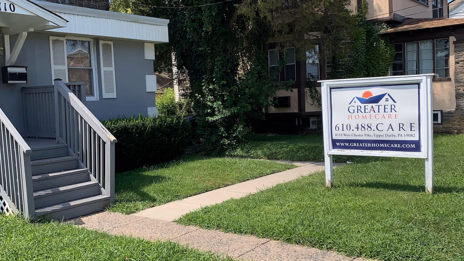 Exterior view of a senior care facility with a sign reading Greater Homecare