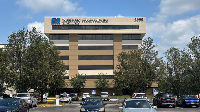 Exterior view of Norton St. Matthews Medical Plaza 1 building with a parking lot.