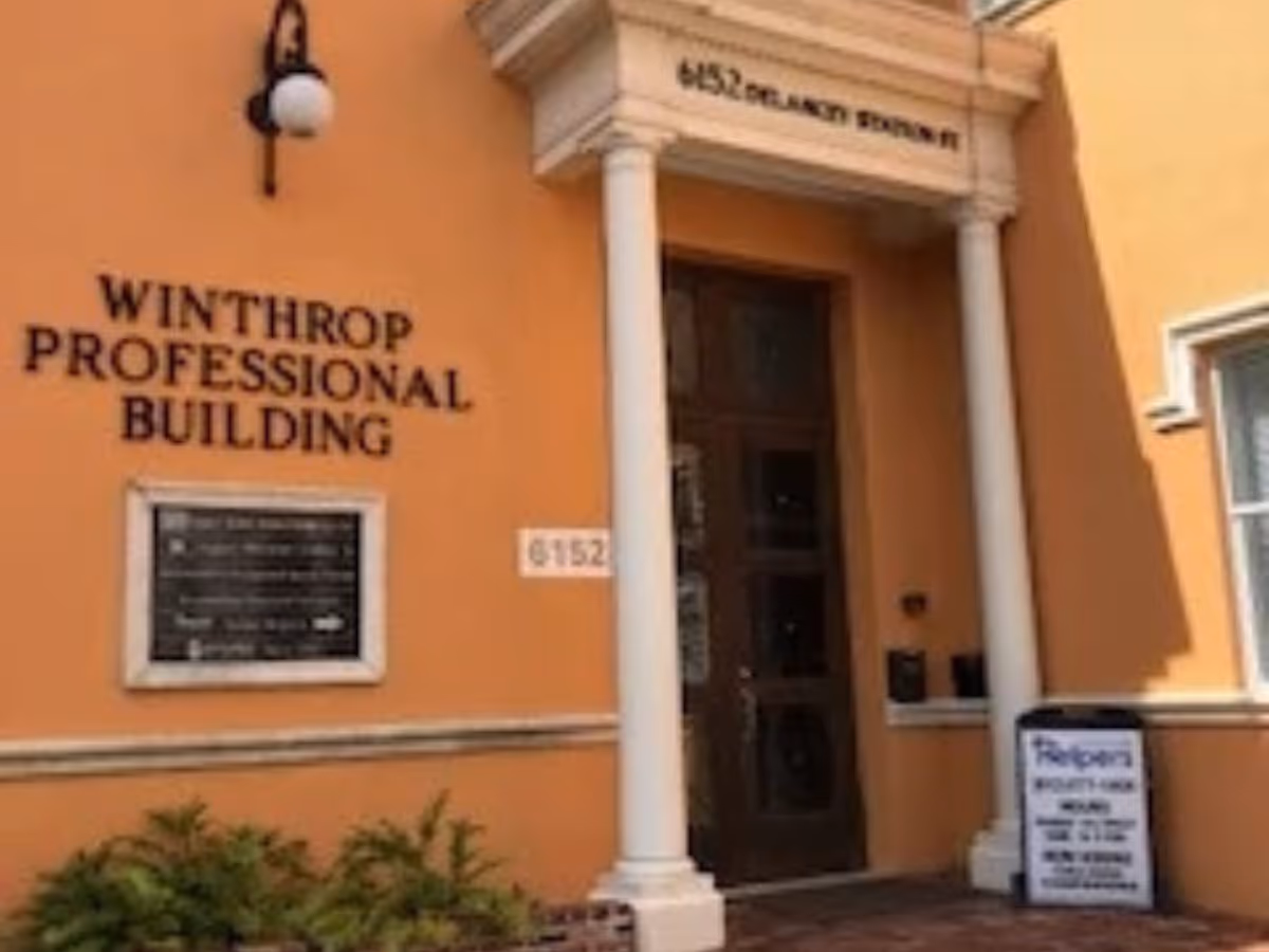 Peach-colored building exterior with white columns and an entrance labeled Winthrop Professional Building.
