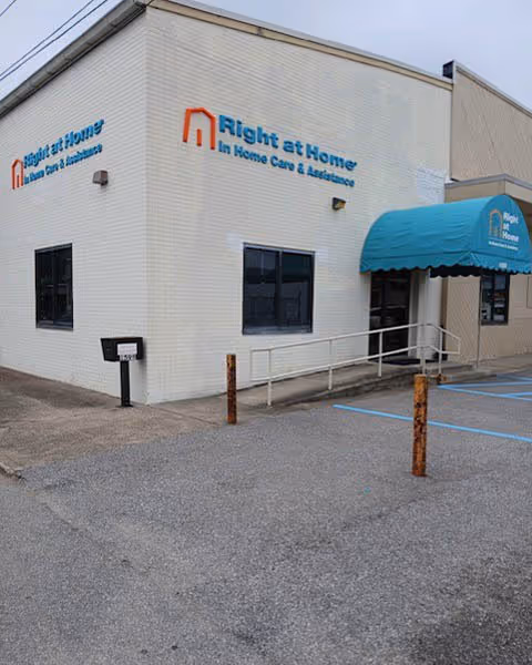 Exterior view of Right at Home facility with blue canopy and signage
