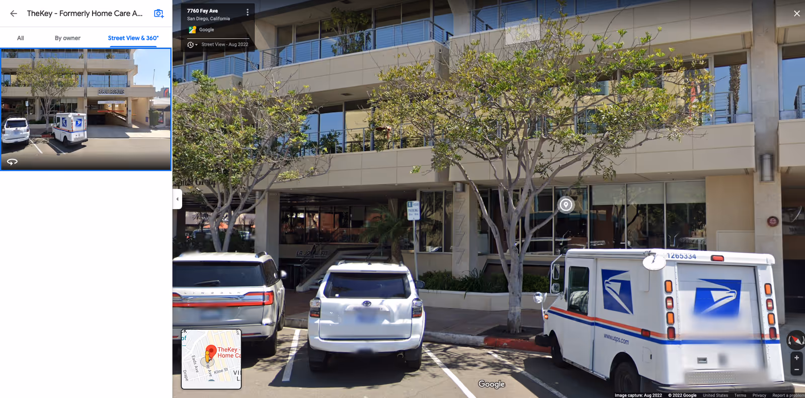 Exterior view of TheKey Senior Home Care building with parked cars and trees.