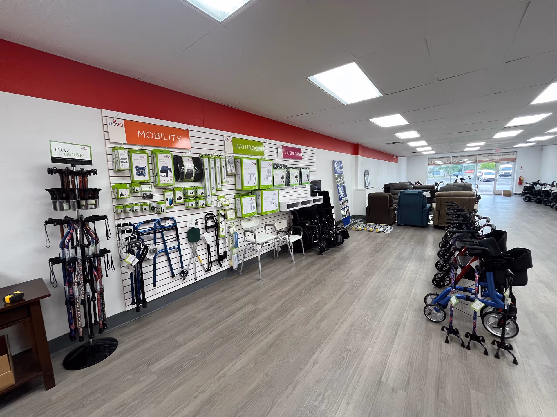 An interior Mobility Plus showroom displaying walkers, canes, and other mobility aids.