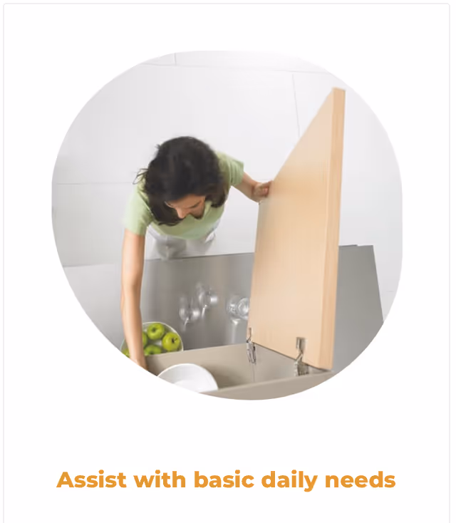 A person opens a kitchen cabinet in a bright, tidy kitchen.