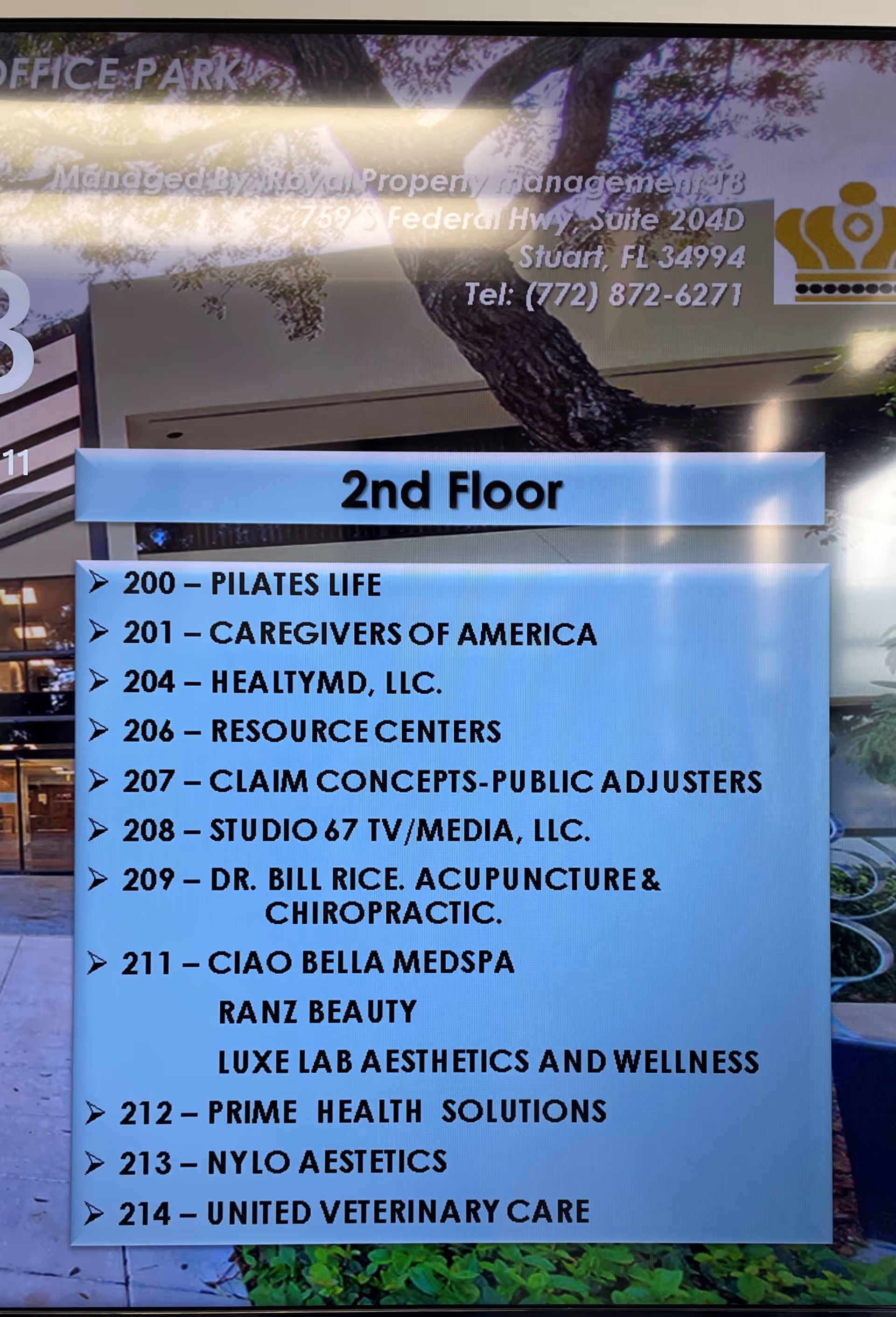 Directory sign on a wall listing offices on the 2nd floor.